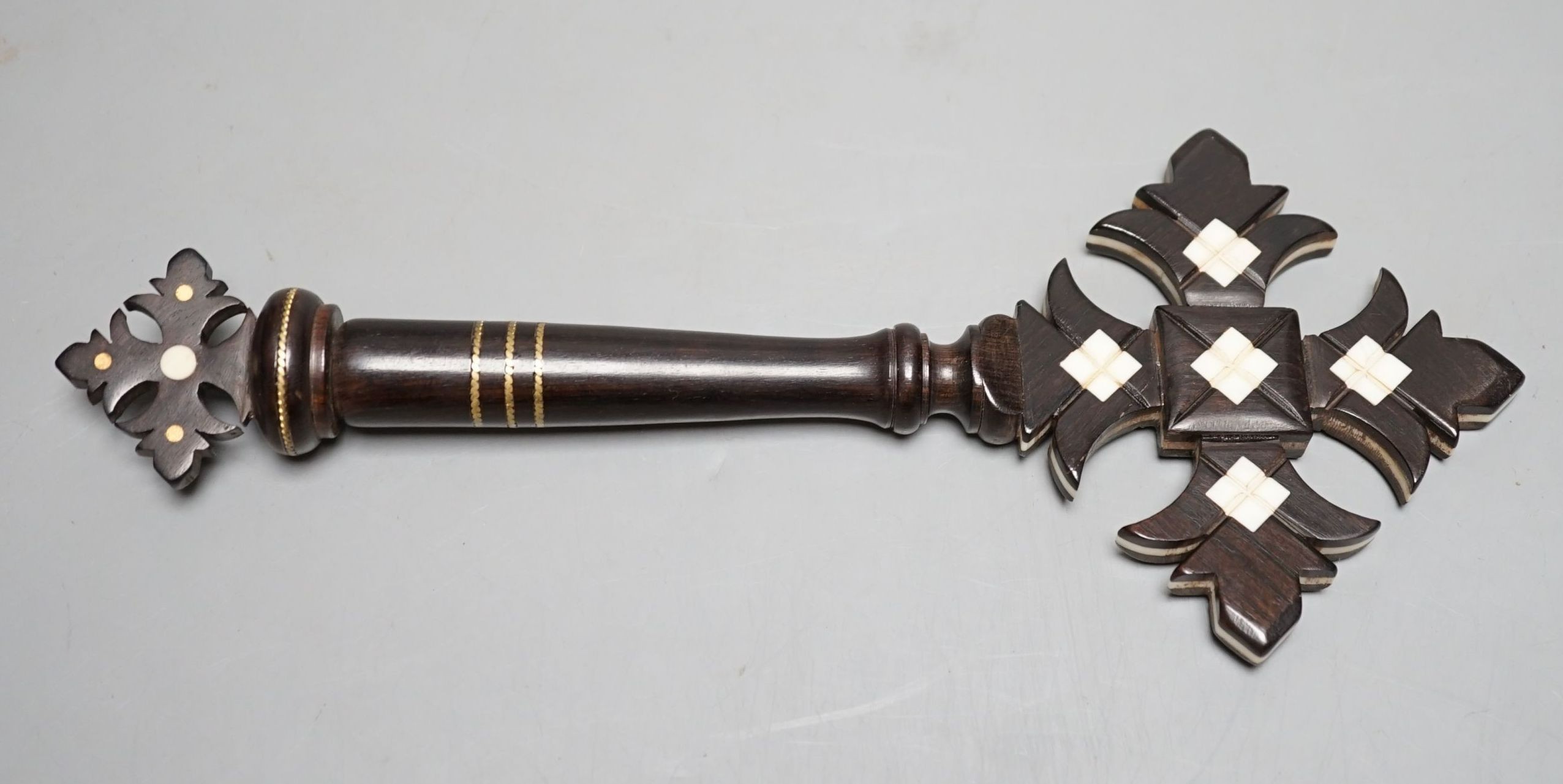An ebony and ivory cross with holy water compartment, 25 cms long.
